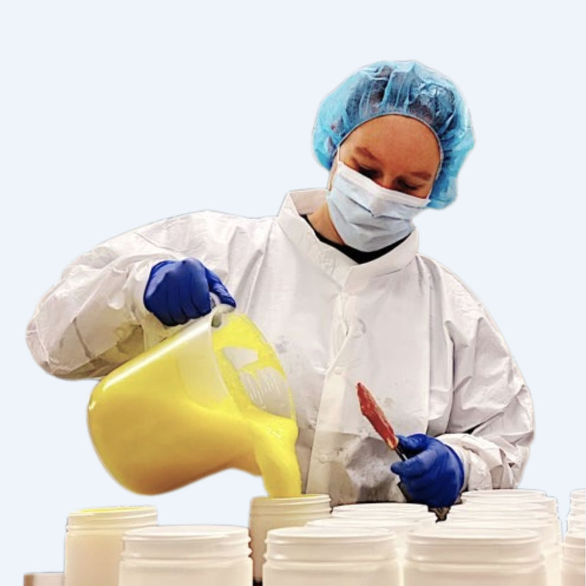 woman compounding yellow paste